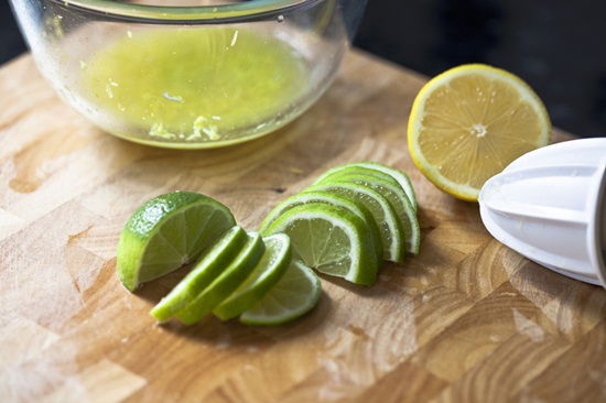 Half a lemon and lime slices --- Image by © the food passionates/Corbis