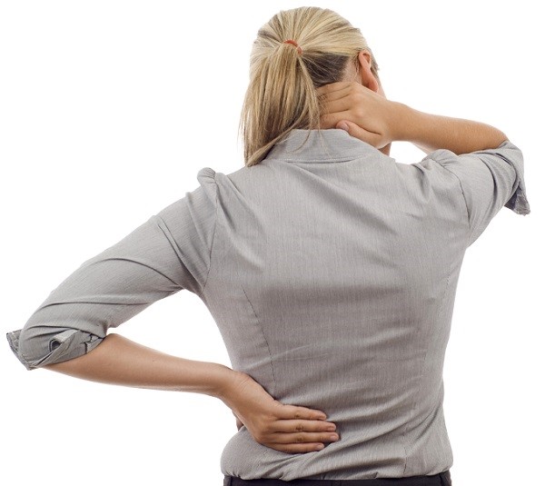 Woman with back pain isolated over a white background