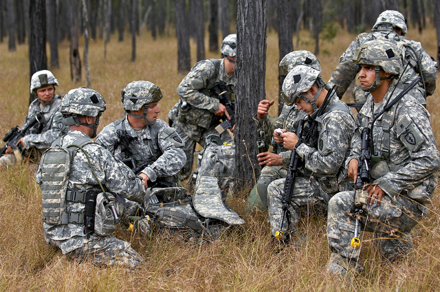 Members of 1st Battalion, 501st Parachute Infantry Regiment, Fort Richardson, Alaska, move out of the drop zone and set up a security perimeter after parachuting out of a U.S. Air Force C-17 Globemaster III aircraft and into the Shoalwater Bay training area, located in Queensland Australia, during exercise Talisman Saber, July 17, 2011.  Talisman Saber 2011 is an exercise designed to train U.S. and Australian forces to plan and conduct Combined Task Force operations to improve combat readiness and interoperability on a variety of missions from conventional conflict to peacekeeping and humanitarian assistance efforts. (U.S. Air Force photo by MSgt Michele A. Desrochers)(Released)