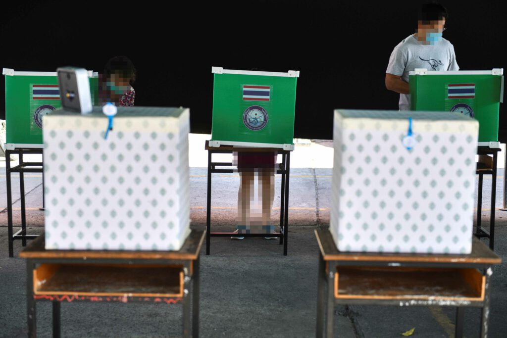 People cast their votes at a polling station during provincial elections in Chonburi province in Thailand, December 20, 2020. REUTERS/Chalinee Thirasupa