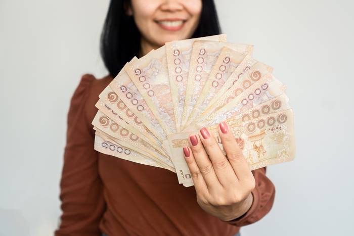 Successful,Asian,Woman,Hand,Showing,Thai,Money,Banknotes,,investment,And