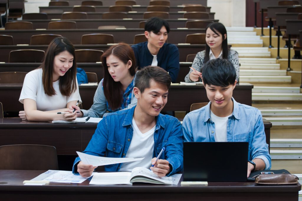 Students having class in university auditorium