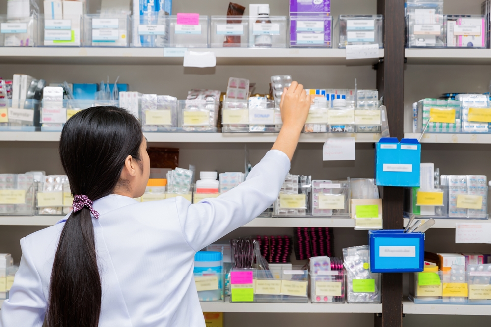 Asian woman a pharmacist in pharmacy room